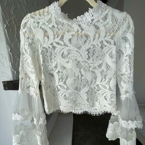 White lace bell sleeve crop top by Lioness.